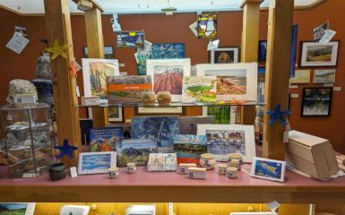 An arranged display of books and other giftware within the Eptek Art and Culture Centre.